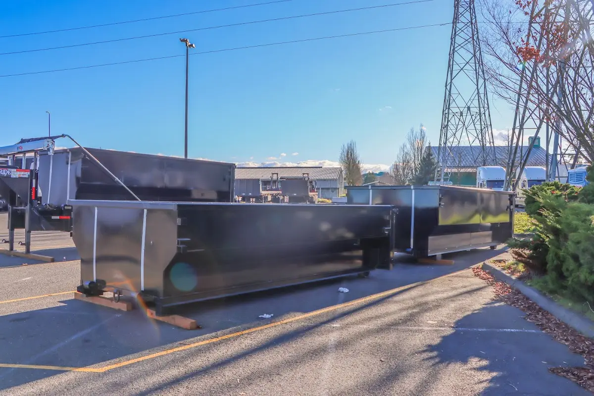 Roll-off dumpster ready for waste disposal at job site for Construction Dumpster Rental in Corning